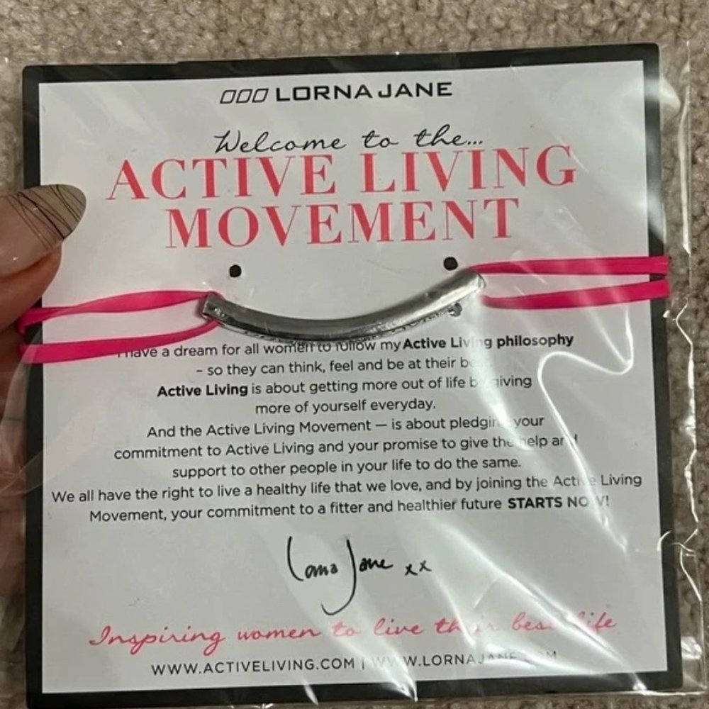 ~Lot of 7: Lorna Jane Pink Bracelet, Zumba Bracelets, CD'S & Les Mills MSRP: $70